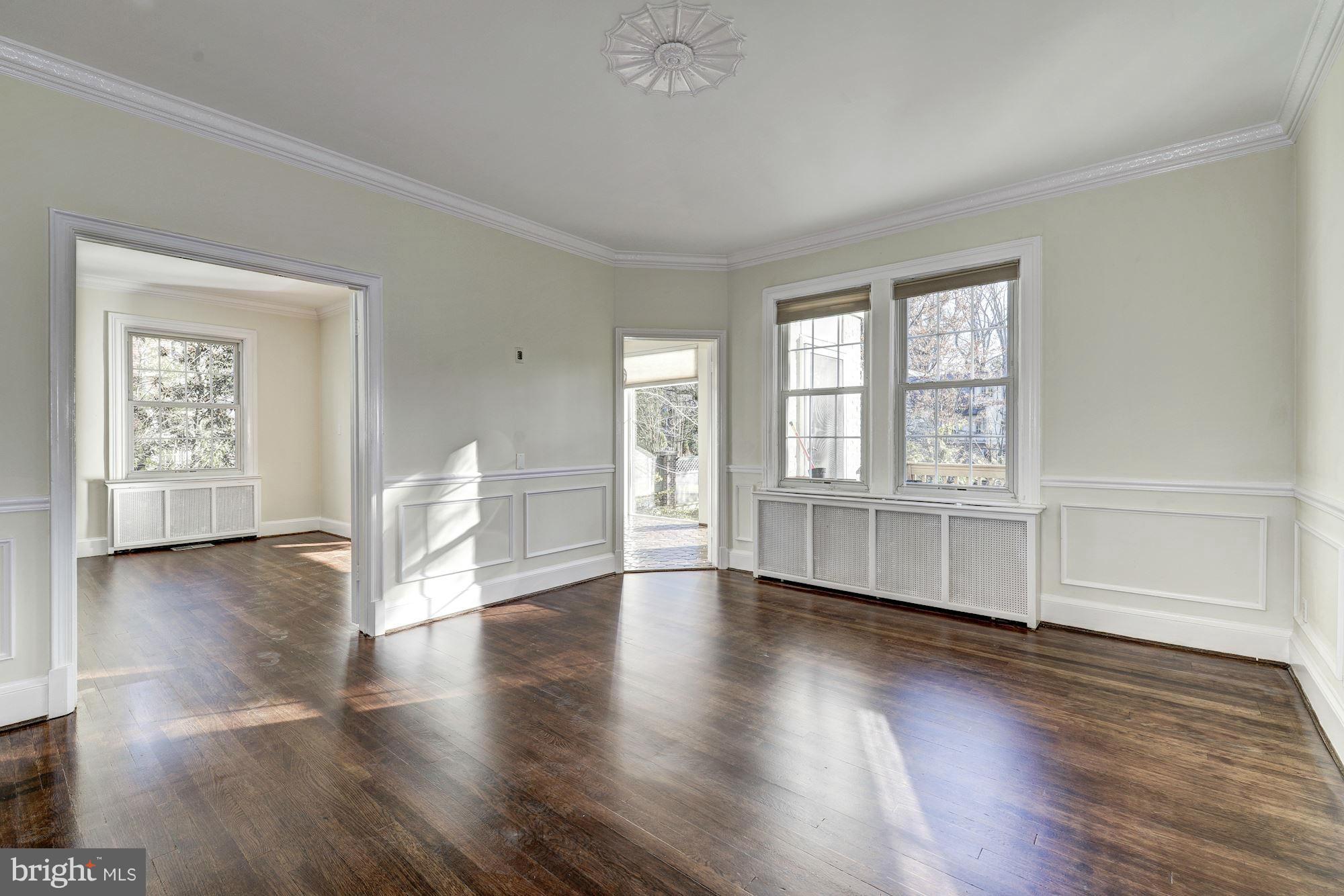 4910 Hillbrook Lane Northwest Washington, DC 20016 - Photo 7 of 30 a view of an empty room with a window and wooden floor