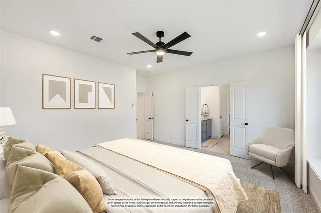 a bedroom with a bed and a couch