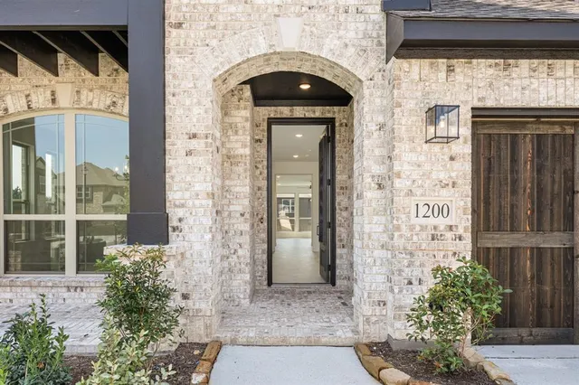 a front view of a house with a glass door
