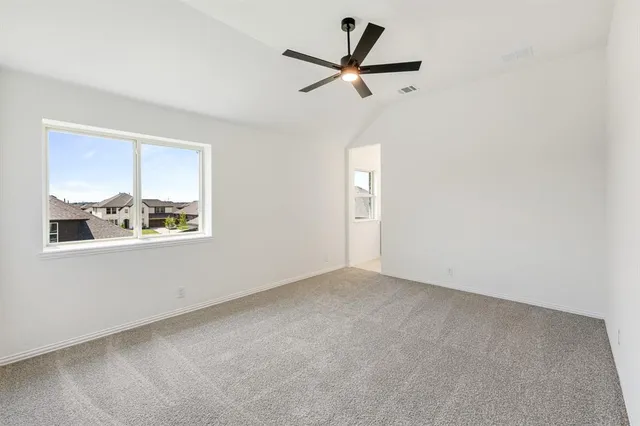 a view of room with a ceiling fan