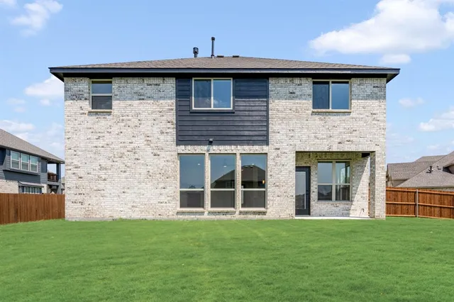 a brick house with a garden