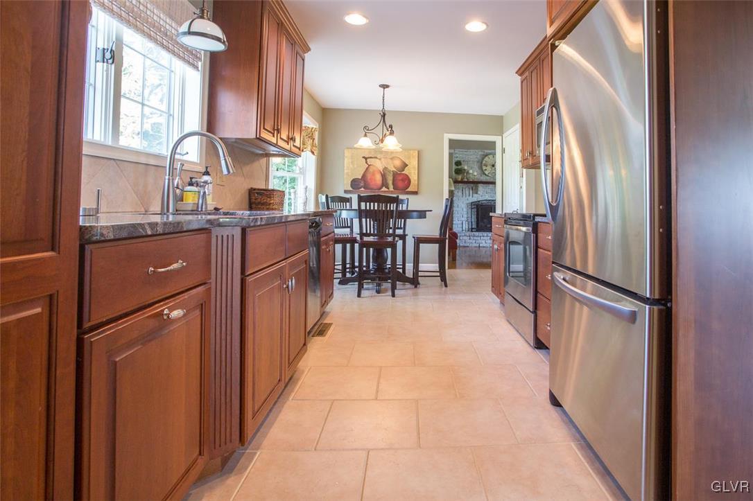 312 Cherry Hill Road Nazareth, PA 18064 - Photo 8 of 28 a kitchen with stainless steel appliances granite countertop a refrigerator and a sink