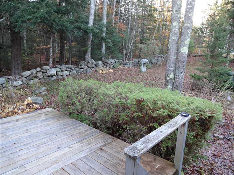 454 Daniels Road Union, ME 04862 - Photo 30 of 33 Exterior Front. Stone Wall is the...