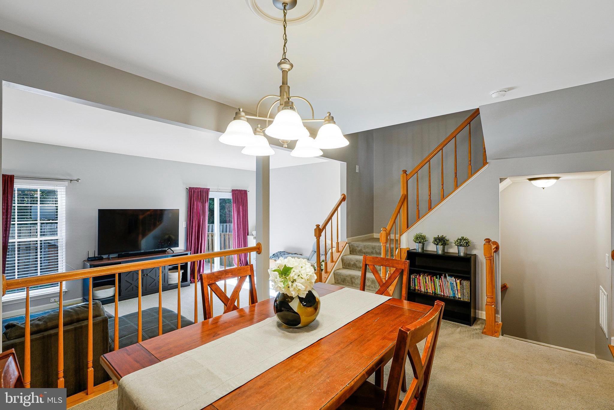 1085 Smartts Lane Northeast Leesburg, VA 20176 - Photo 11 of 38 a living room with furniture and a flat screen tv