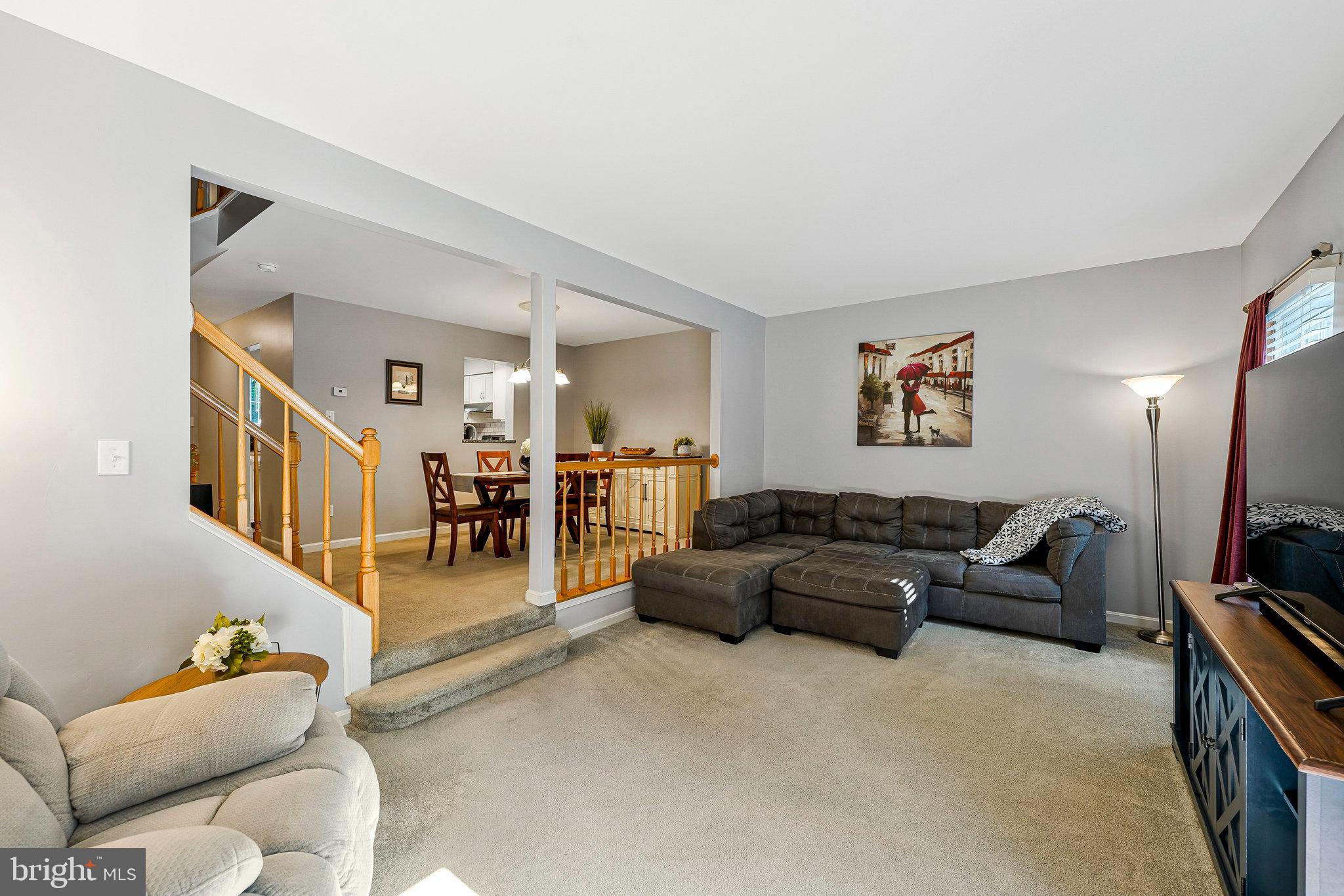 1085 Smartts Lane Northeast Leesburg, VA 20176 - Photo 13 of 38 a living room with furniture and a flat screen tv