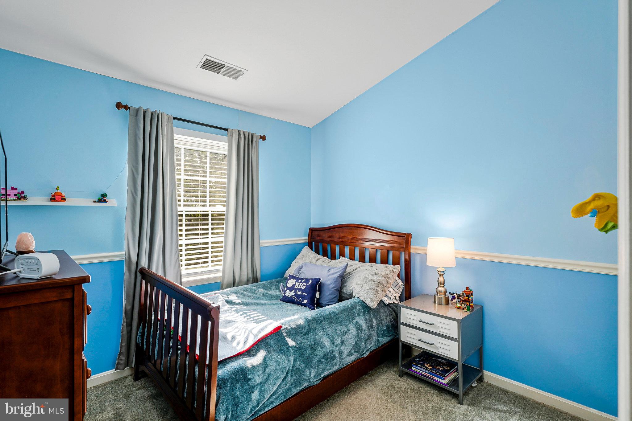 1085 Smartts Lane Northeast Leesburg, VA 20176 - Photo 17 of 38 a bedroom with two beds and a window