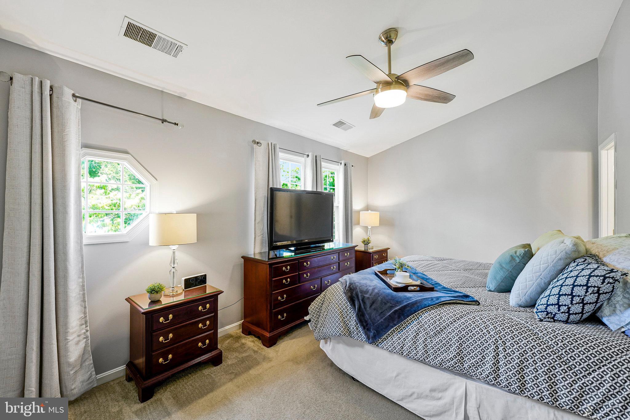 1085 Smartts Lane Northeast Leesburg, VA 20176 - Photo 21 of 38 a living room with furniture and a flat screen tv