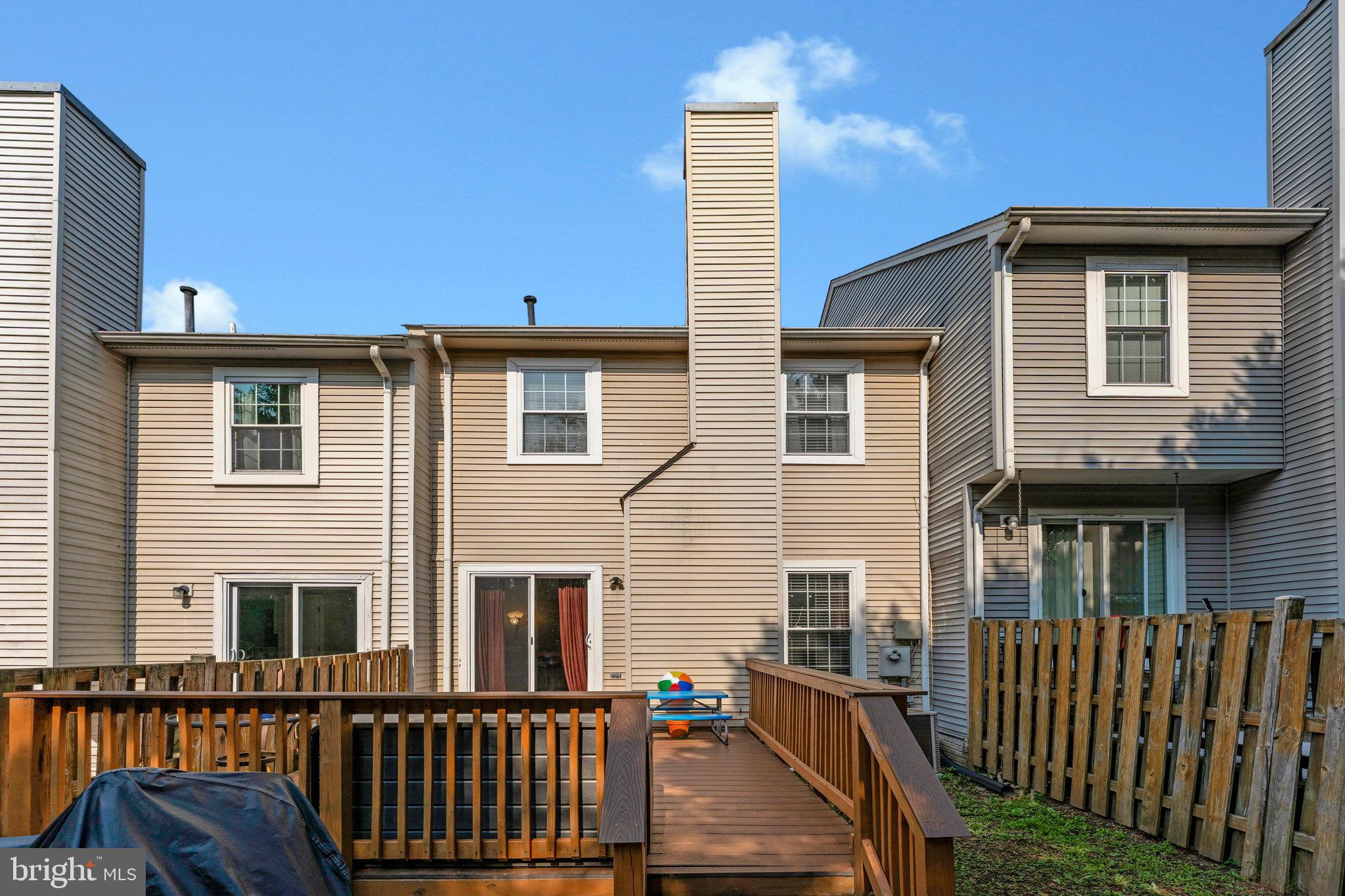 1085 Smartts Lane Northeast Leesburg, VA 20176 - Photo 32 of 38 a view of a house with wooden deck