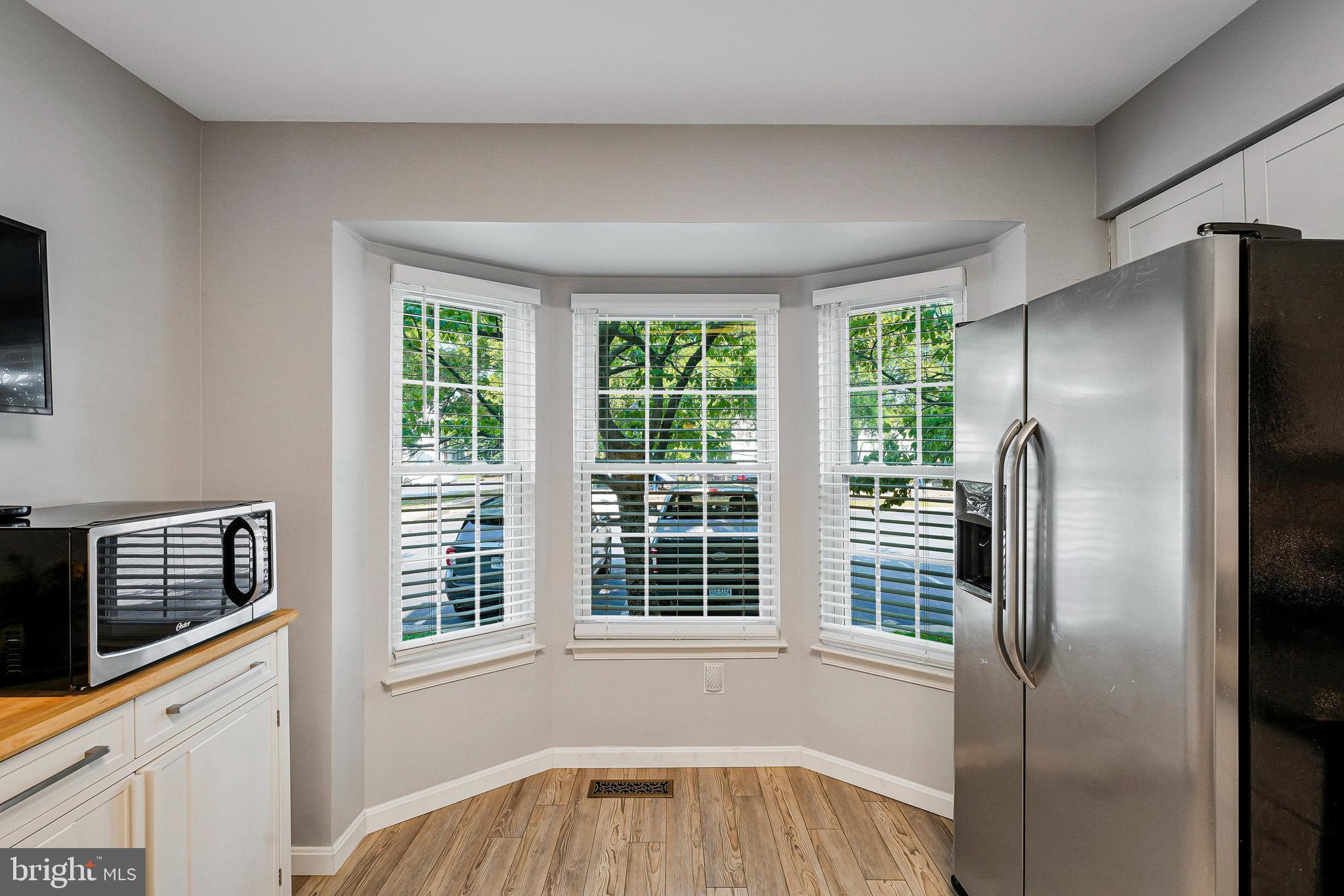 1085 Smartts Lane Northeast Leesburg, VA 20176 - Photo 9 of 38 a view of a kitchen that has a refrigerator and window