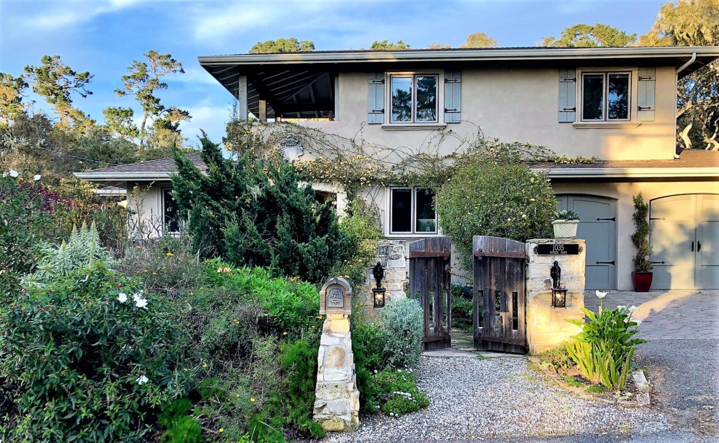 a front view of a house with garden
