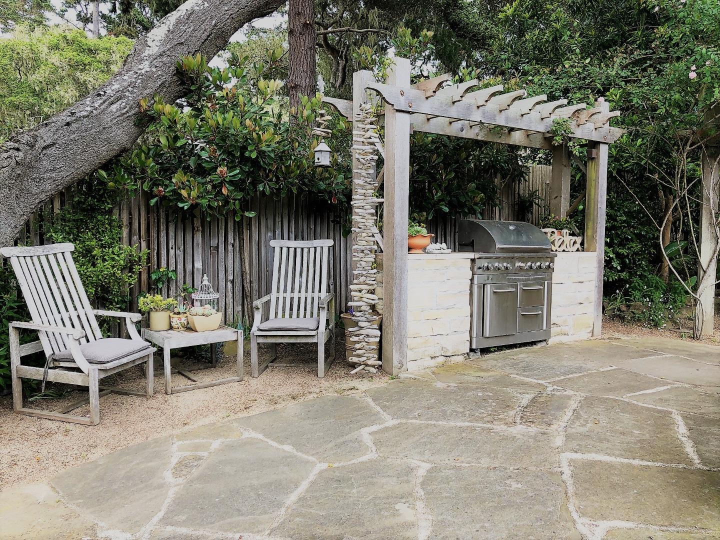 1035 Ortega Road Pebble Beach, CA 93953 - Photo 14 of 18 a view of a patio with a table and chairs