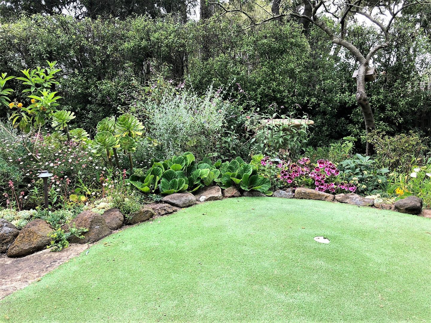 1035 Ortega Road Pebble Beach, CA 93953 - Photo 16 of 18 a view of a garden with flowers and trees