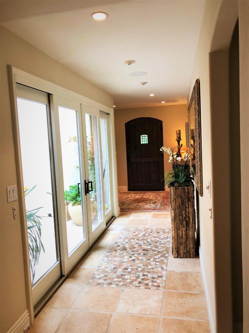 1035 Ortega Road Pebble Beach, CA 93953 - Photo 3 of 18 a view of hallway with furniture and a porch
