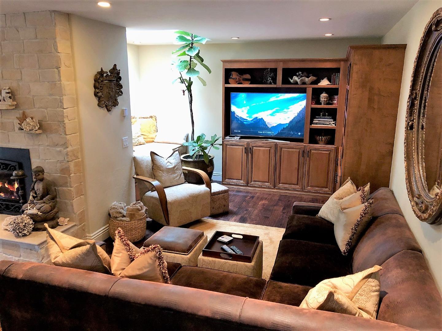 1035 Ortega Road Pebble Beach, CA 93953 - Photo 8 of 18 a living room with furniture and a flat screen tv