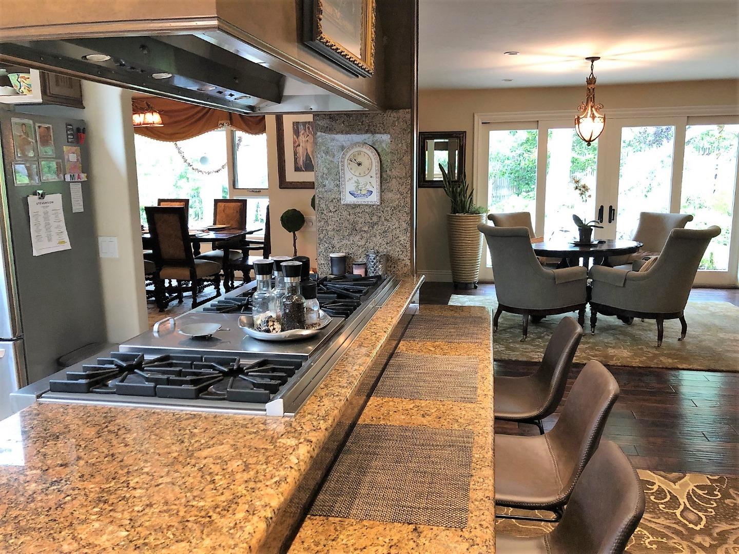 1035 Ortega Road Pebble Beach, CA 93953 - Photo 10 of 18 a dining room with furniture and wooden floor