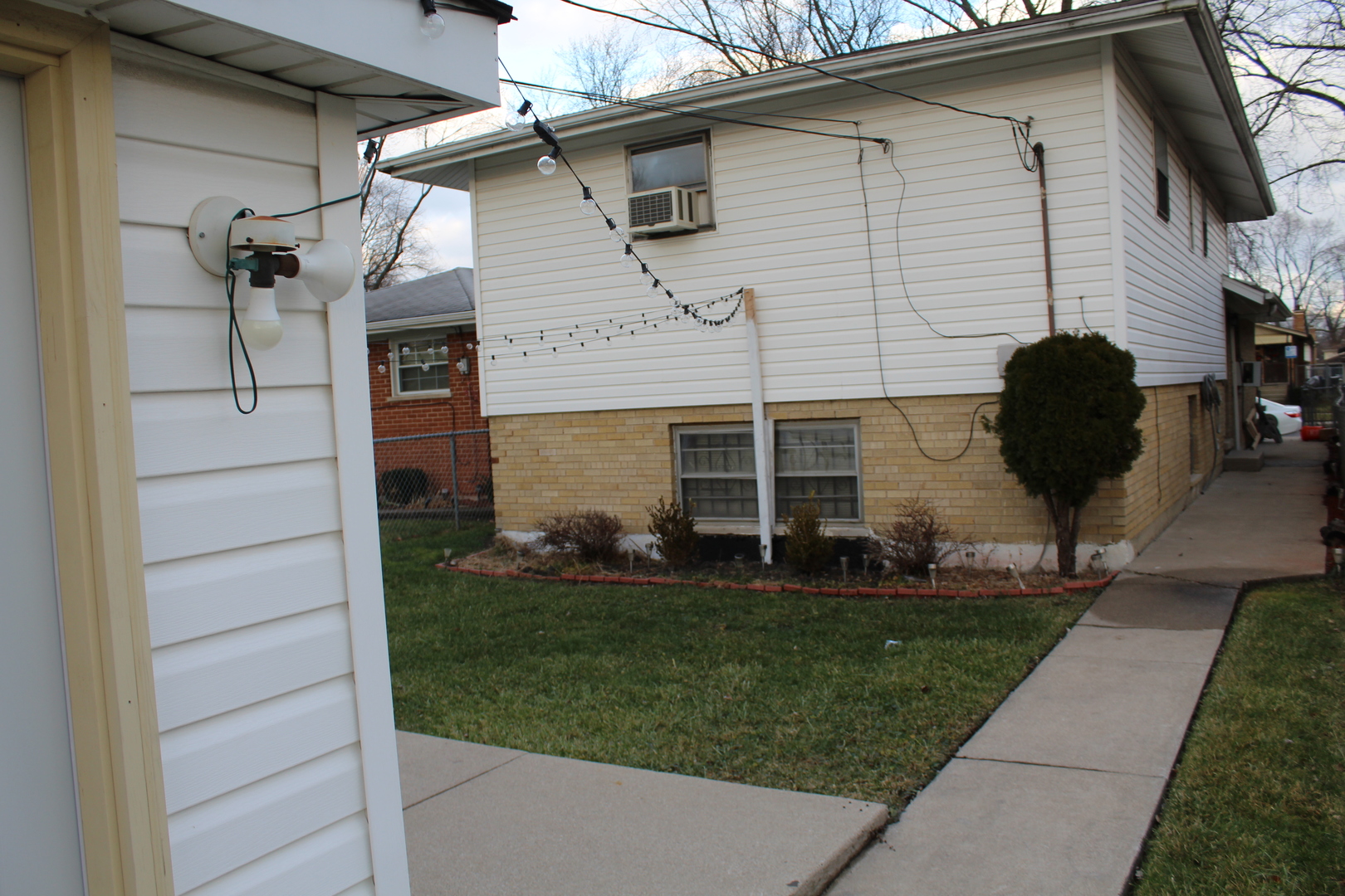 11630 South Throop Street Chicago, IL 60643 - Photo 4 of 15 a front view of a house with a garden and yard