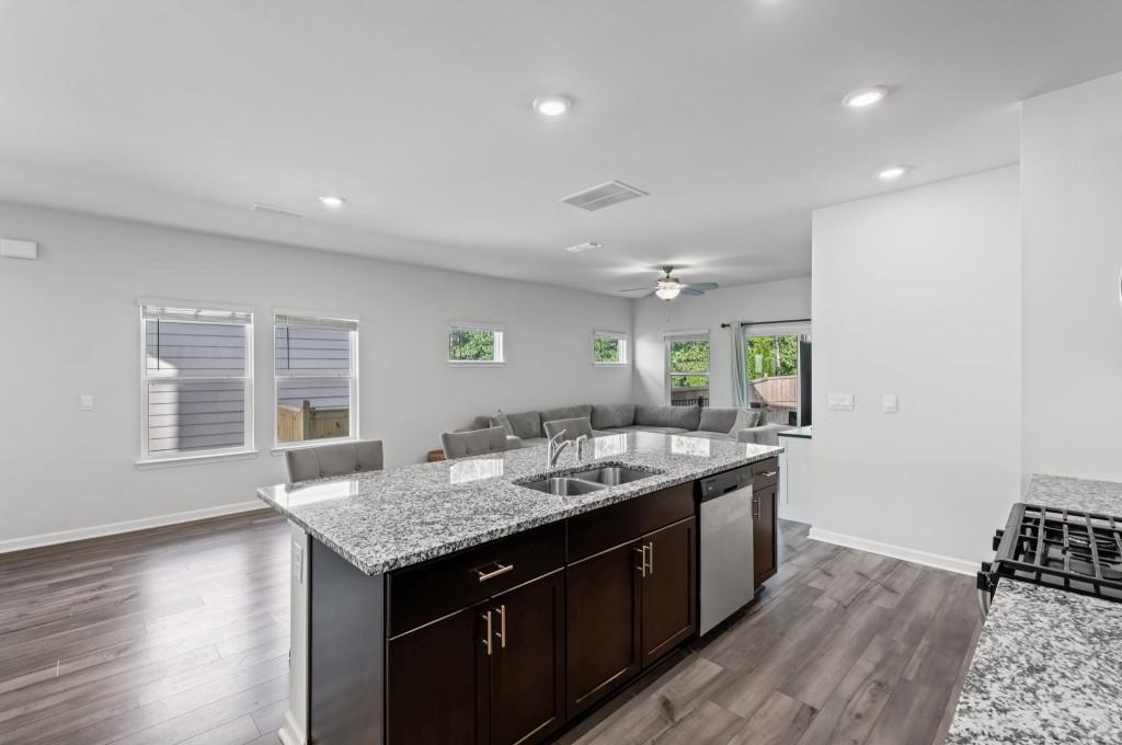 346 Wells Circle Canton, GA 30114 - Photo 14 of 35 a kitchen with a stove and a wooden floor