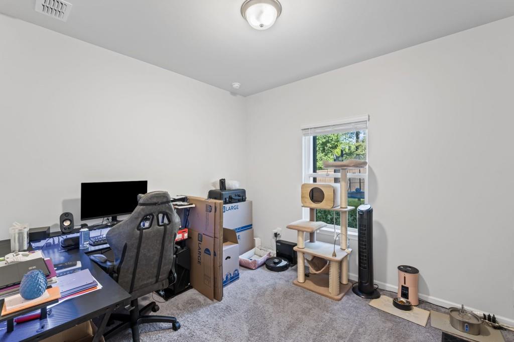 346 Wells Circle Canton, GA 30114 - Photo 16 of 35 a view of a workspace with furniture and a window