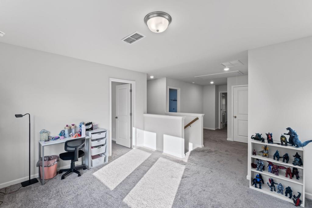 346 Wells Circle Canton, GA 30114 - Photo 19 of 35 a living room with furniture and a dining table