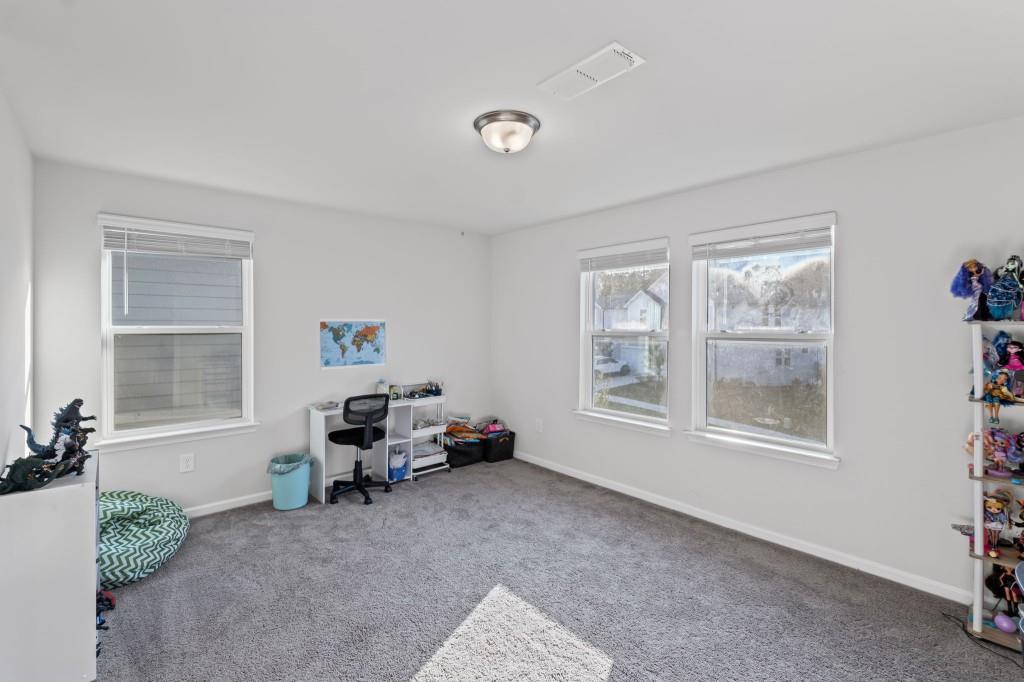 346 Wells Circle Canton, GA 30114 - Photo 20 of 35 a living room with furniture toys and a window