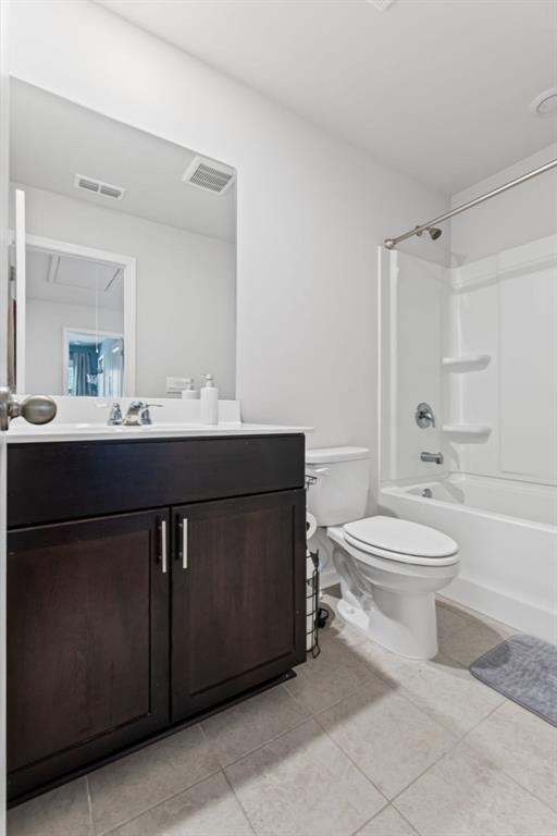 346 Wells Circle Canton, GA 30114 - Photo 29 of 35 a bathroom with a toilet sink and mirror