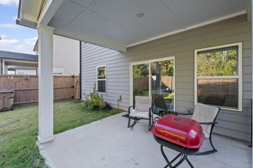 346 Wells Circle Canton, GA 30114 - Photo 31 of 35 a view of a backyard with furniture and a yard