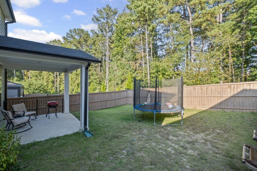 346 Wells Circle Canton, GA 30114 - Photo 32 of 35 a view of a backyard with plants and a backyard