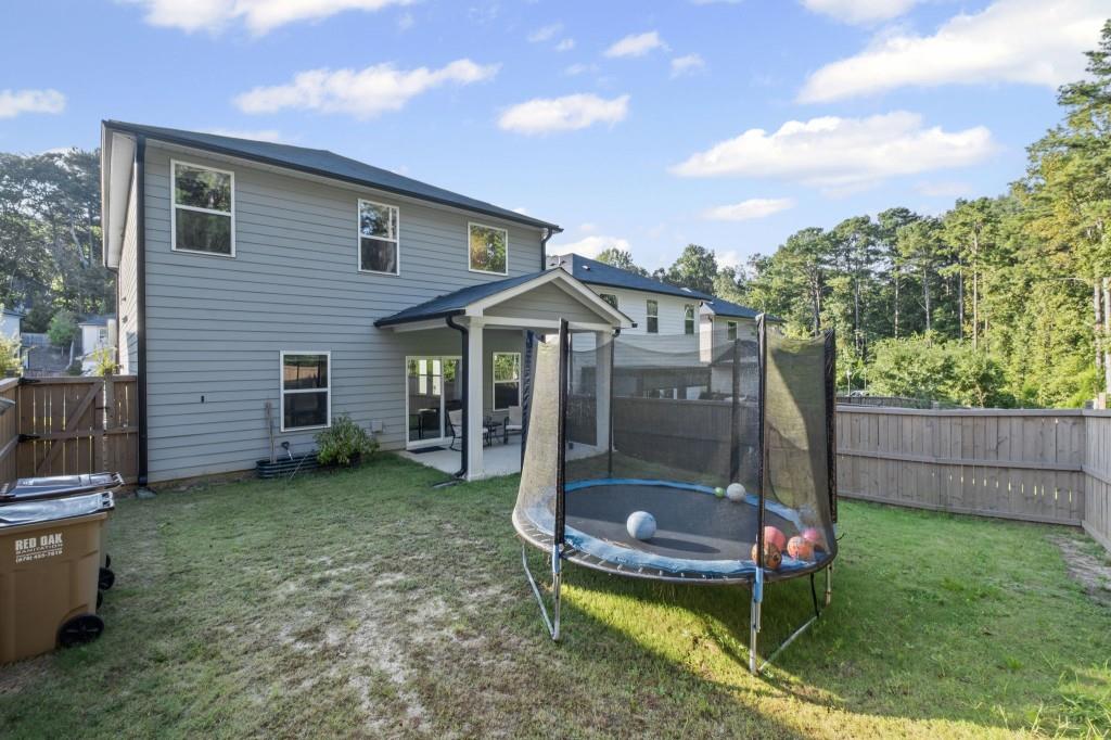 346 Wells Circle Canton, GA 30114 - Photo 35 of 35 a view of a chair and table in backyard of the house