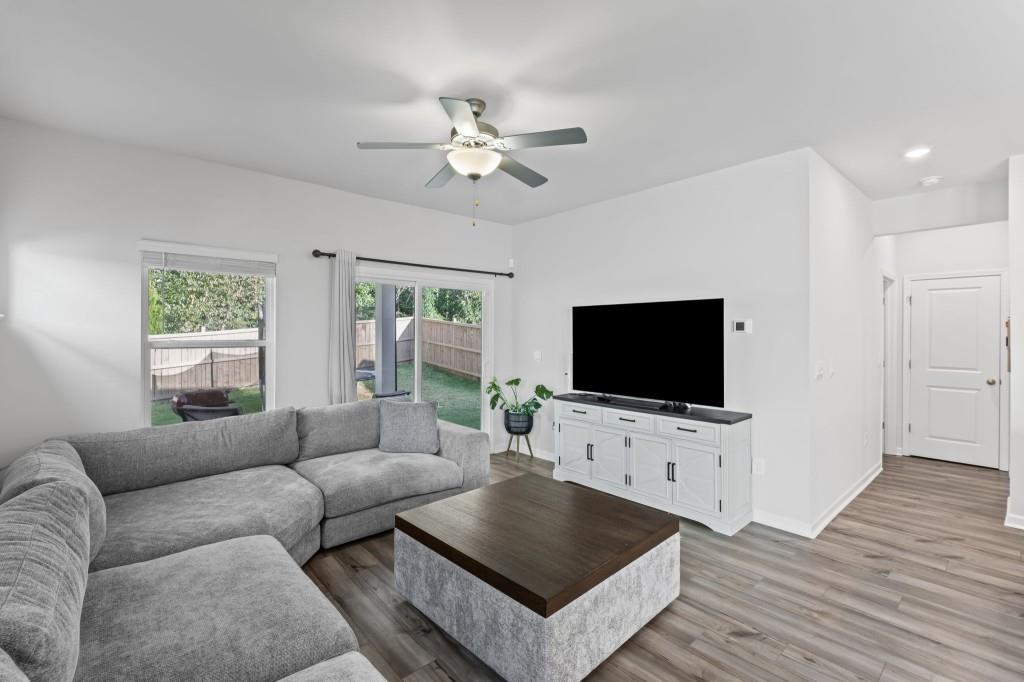 346 Wells Circle Canton, GA 30114 - Photo 7 of 35 a living room with furniture and a flat screen tv