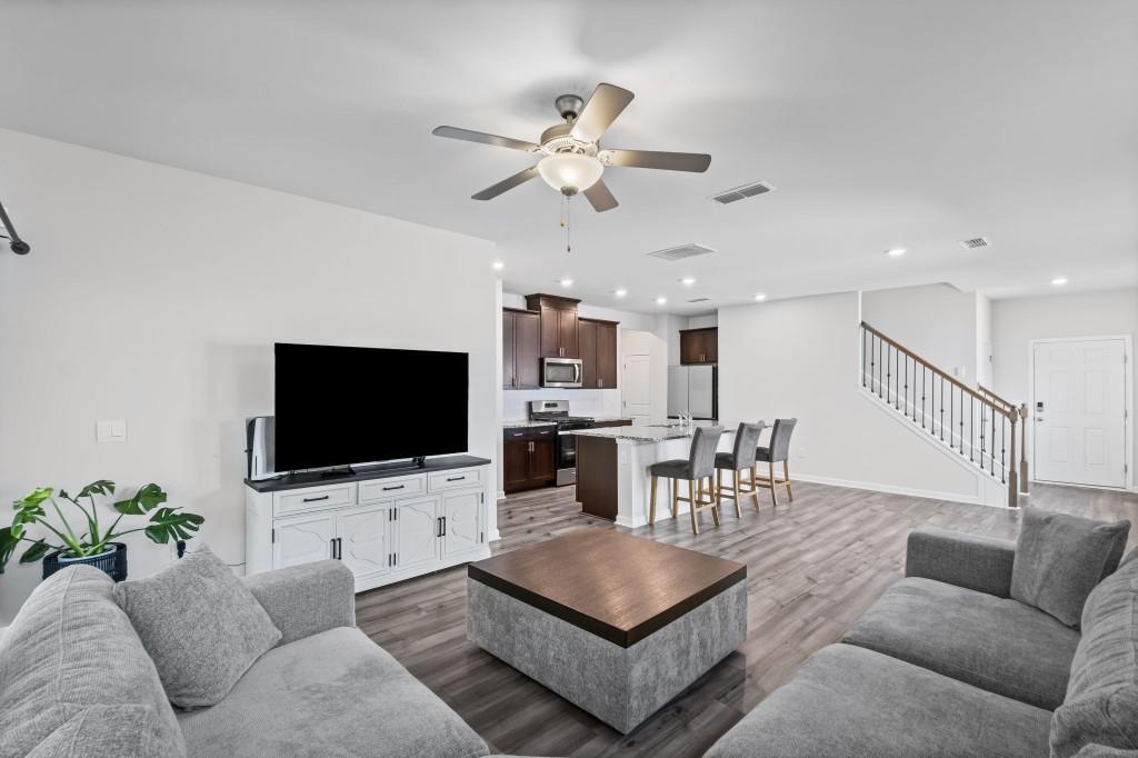 346 Wells Circle Canton, GA 30114 - Photo 8 of 35 a living room with furniture and a flat screen tv