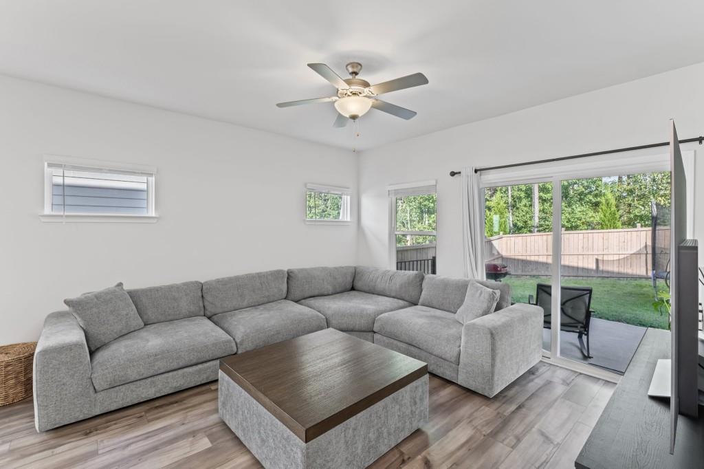 346 Wells Circle Canton, GA 30114 - Photo 9 of 35 a living room with furniture and a large window