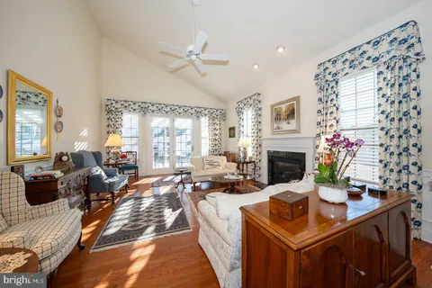 an outdoor dining space with furniture and a chandelier