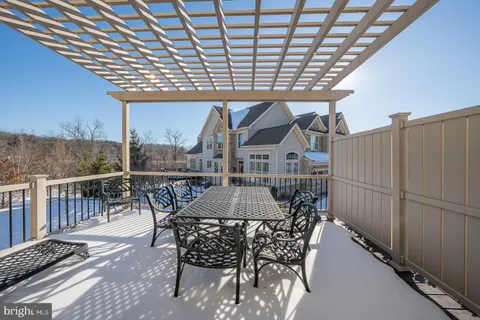 a bedroom with a bed and a dresser in it