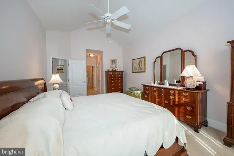 a bathroom with a double vanity sink mirror and shower