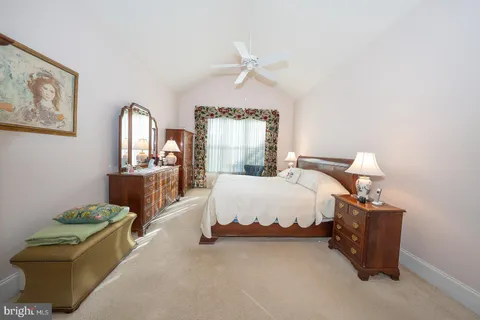 a view of walk in closet with clothes