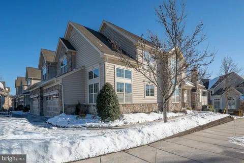 a view of a livingroom with furniture and a workspace