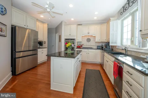 a living room with furniture and a lamp