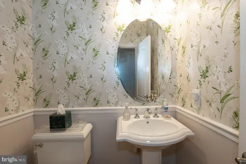 a bed room with a bed and a chair