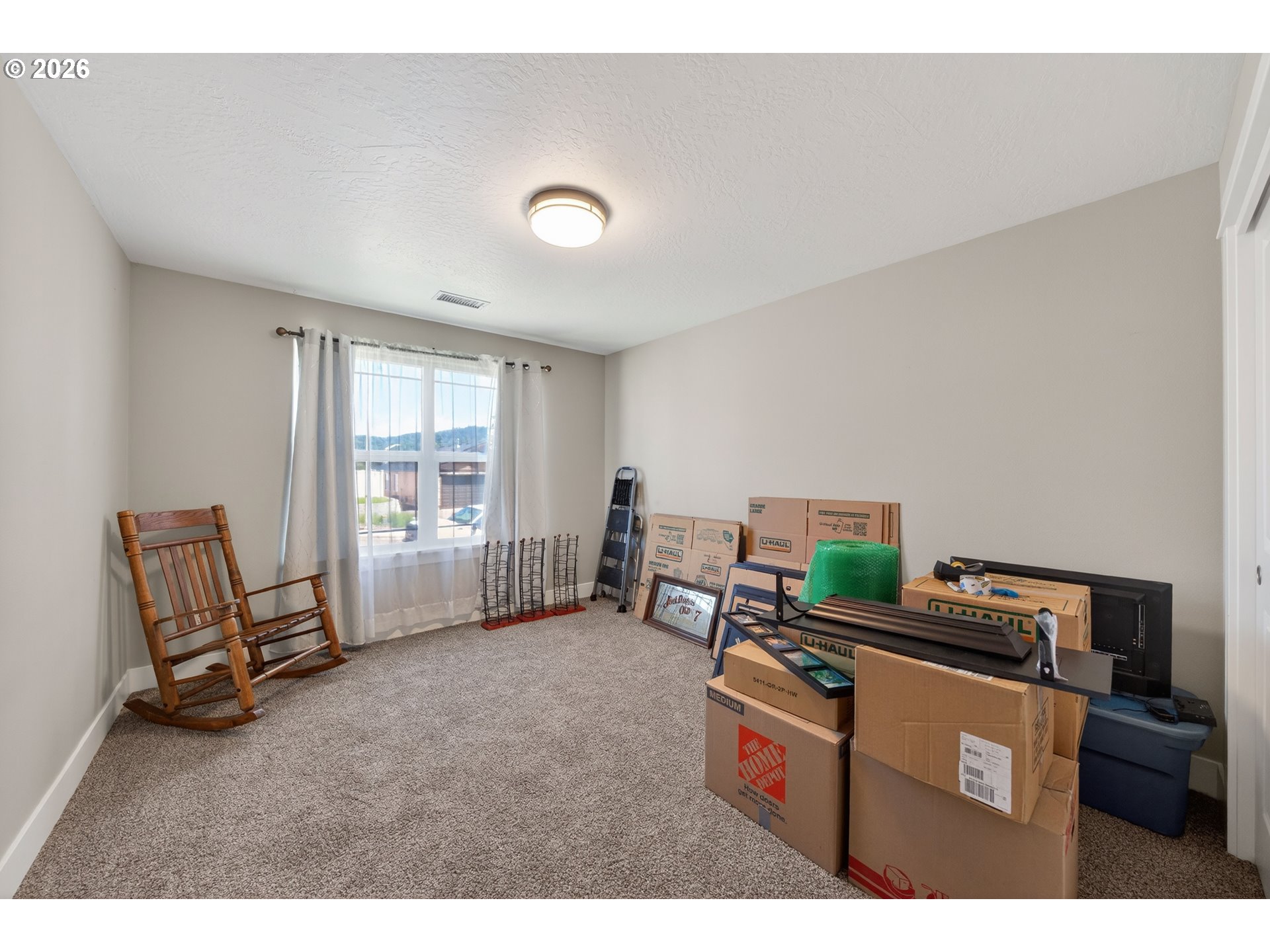 601 Southeast Rose Ridge Drive Winston, OR 97496 - Photo 18 of 40 a room with furniture and a window