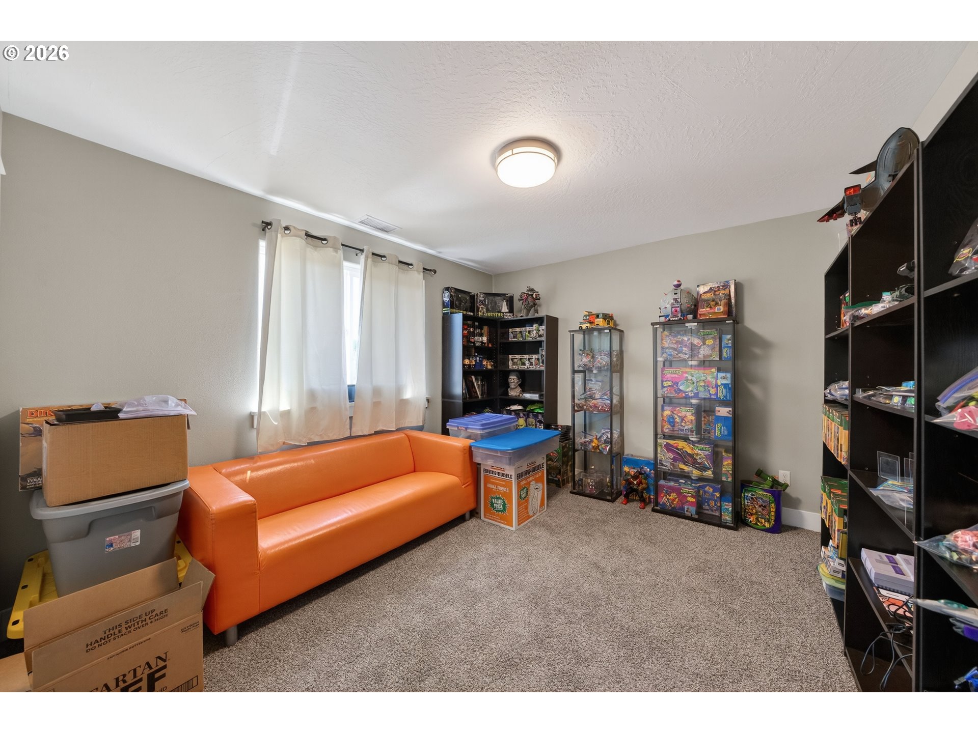 601 Southeast Rose Ridge Drive Winston, OR 97496 - Photo 20 of 40 a bedroom with furniture and a lamp