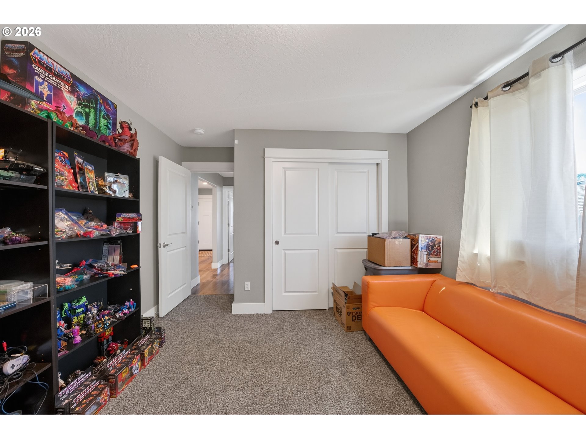 601 Southeast Rose Ridge Drive Winston, OR 97496 - Photo 21 of 40 a bedroom with furniture and a book shelf