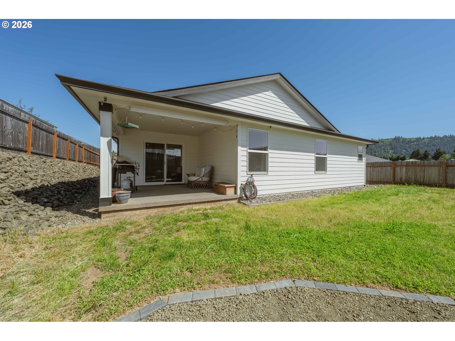601 Southeast Rose Ridge Drive Winston, OR 97496 - Photo 30 of 40 a view of a house with backyard