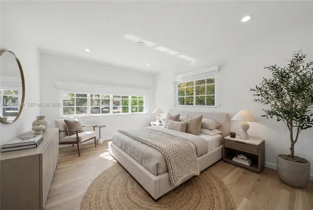 a bedroom with a bed and a couch