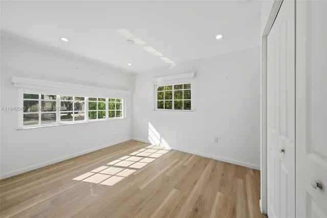 a view of empty room with windows