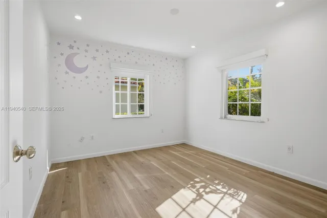 an empty room with windows