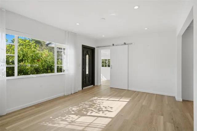 a view of an empty room with a window