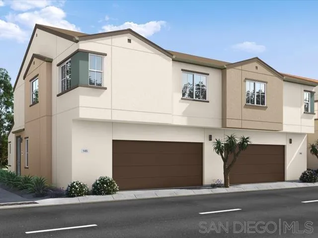 a front view of a house with garage