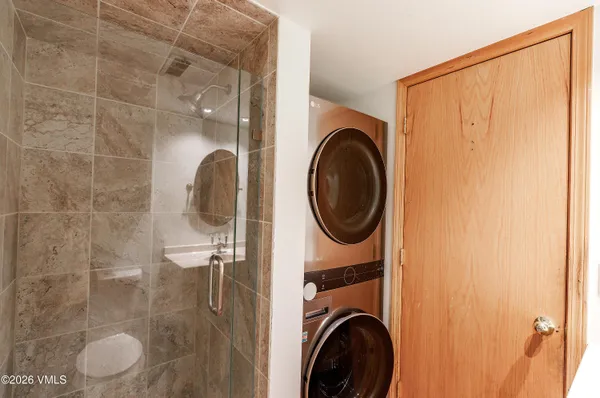 a view of a bathroom with a washer and dryer