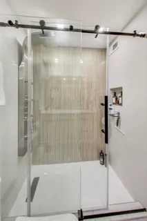 a bathroom with a bathtub and a shower