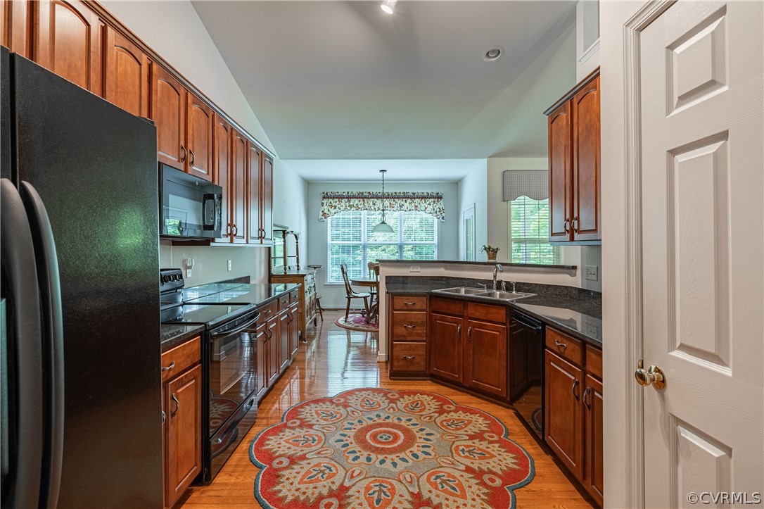 125 Jesse's Way Farmville, VA 23901 - Photo 12 of 42 a kitchen with stainless steel appliances granite countertop a stove a sink and a refrigerator